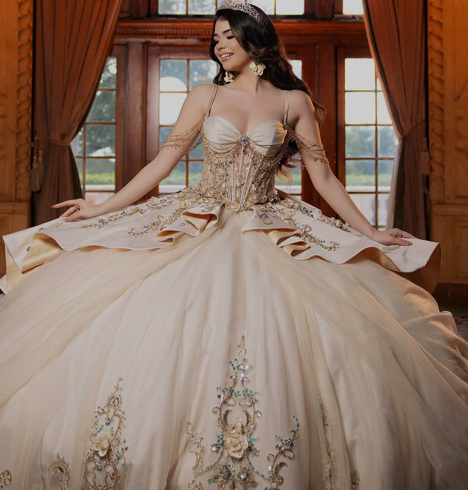 Quinceañera girl wearing an elegant gold ball gown. Mobile image