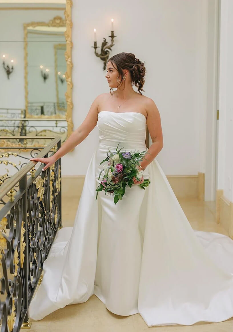 Bride holding a colorful bouquet in an elegant interior